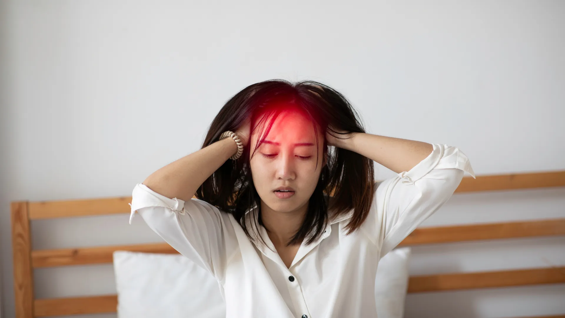 Woman experiencing a migraine headache